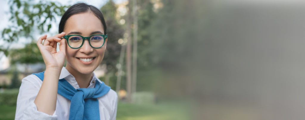 Background image displaying woman wearing glasses with high quality lenses